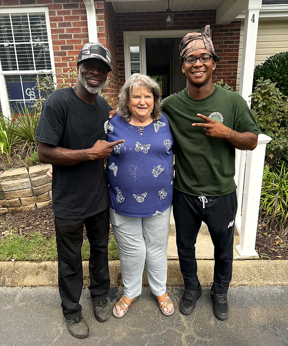 A Carter's Care customer with two crew members after her move in Greenville SC
