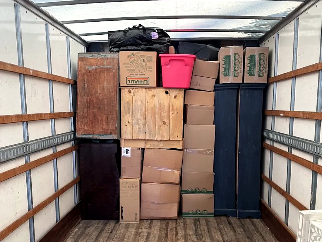Moving truck loaded with neatly stacked boxes and furniture in Greenville SC